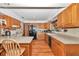Efficient kitchen featuring oak cabinets, laminate countertops, and modern appliances at 2676 Se 52Nd Ave, Ocala, FL 34480