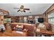 Comfortable living room with a brick fireplace and an open layout connecting to the dining area at 2676 Se 52Nd Ave, Ocala, FL 34480