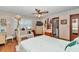 Main bedroom with wood floors, ceiling fan, and ensuite bathroom access at 2676 Se 52Nd Ave, Ocala, FL 34480