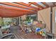 Cozy covered patio with wood flooring, red ceiling, and lots of plants at 2676 Se 52Nd Ave, Ocala, FL 34480