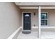 Close up of the entry with a decorative glass accent and a neutral exterior paint at 2690 Sw 154Th Ln, Ocala, FL 34473