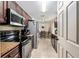Spacious kitchen featuring stainless steel appliances and views into the dining area at 2690 Sw 154Th Ln, Ocala, FL 34473