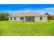Expansive green backyard offers ample space for outdoor activities and relaxation at 2792 Se 29Th St, Ocala, FL 34471