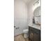 Powder room with a decorative mirror, modern vanity, and stylish fixtures at 2792 Se 29Th St, Ocala, FL 34471