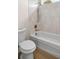 Bathroom with shower and tub, and features a shower head with white tile at 2792 Se 29Th St, Ocala, FL 34471