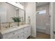 Bathroom featuring double vanity with vessel sinks, marble countertops, and a separate room with a tub and shower at 2792 Se 29Th St, Ocala, FL 34471