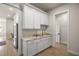 Charming butler's pantry with ample storage, marble countertop, and gold hardware at 2792 Se 29Th St, Ocala, FL 34471