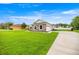 Charming single-story home featuring a stone facade and a well-manicured lawn at 2792 Se 29Th St, Ocala, FL 34471