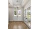 Foyer features hardwood floors and double doors leading outside at 2792 Se 29Th St, Ocala, FL 34471