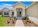Charming home entrance features manicured landscaping, stone accents, and a covered porch at 2792 Se 29Th St, Ocala, FL 34471