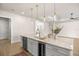 Bright kitchen featuring a large island with marble countertop, gold hardware, and pendant lighting at 2792 Se 29Th St, Ocala, FL 34471
