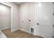 Neutral laundry room with wood-look tile flooring and white trim, ready for appliances at 2792 Se 29Th St, Ocala, FL 34471