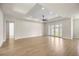 Open-concept living room boasts tray ceilings, recessed lighting, and wood-look tile flooring at 2792 Se 29Th St, Ocala, FL 34471