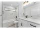 Modern bathroom featuring marble tile, sleek vanity, and shower-tub combo at 28 Water Track Dr, Ocala, FL 34472