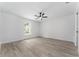 Clean bedroom with wood-look floors, a window, and neutral walls at 28 Water Track Dr, Ocala, FL 34472