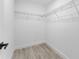 A walk-in closet with ample shelving, offering practical and organized storage space at 28 Water Track Dr, Ocala, FL 34472