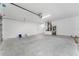 Spacious garage with concrete flooring and ample room for storage at 28 Water Track Dr, Ocala, FL 34472