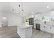 Kitchen view with stainless steel appliances and light colored wood flooring at 28 Water Track Dr, Ocala, FL 34472