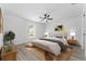 Comfortable main bedroom with decor, ceiling fan, and a window offering natural light at 28 Water Track Dr, Ocala, FL 34472