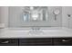 Elegant bathroom featuring a white marble countertop, modern fixtures, and a frameless mirror at 3440 Sw 66Th St, Ocala, FL 34476