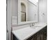 Bathroom vanity with a white countertop and dark wood cabinets at 3440 Sw 66Th St, Ocala, FL 34476
