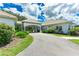 Beautiful exterior view of estate featuring porte-cochere and circular driveway at 3440 Sw 66Th St, Ocala, FL 34476