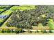 An aerial view outlining the property's boundaries, showcasing its size and wooded areas at 3440 Sw 66Th St, Ocala, FL 34476