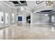 Expansive living area with marble floors, high ceilings, elegant chandeliers, and views of the kitchen area at 3440 Sw 66Th St, Ocala, FL 34476