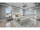 Tranquil bedroom features a king bed, stylish rug, and double doors to a balcony at 3440 Sw 66Th St, Ocala, FL 34476