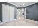 Office space featuring marble floors, neutral paint, double doors, and closet storage at 3440 Sw 66Th St, Ocala, FL 34476