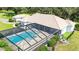 An aerial view of the screened-in pool and spa, offering a private outdoor oasis at 3440 Sw 66Th St, Ocala, FL 34476