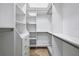 Walk-in closet with custom shelving and drawers for clothing and accessories at 3440 Sw 66Th St, Ocala, FL 34476