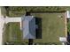 Aerial view showcases the house with a large, well-maintained lawn and a concrete driveway at 3645 Sw 151St Ct, Ocala, FL 34481