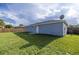 Large backyard with a well-maintained lawn, a satellite dish, and a privacy fence around the perimeter at 3645 Sw 151St Ct, Ocala, FL 34481