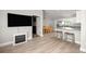 Open-concept living space with hardwood floors and adjacent eat-in kitchen at 3645 Sw 151St Ct, Ocala, FL 34481