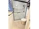 Shower stall with a modern black frame and fixtures next to a toilet at 37 Oak Loop, Ocala, FL 34472