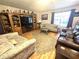 Spacious living room featuring hardwood floors, comfortable seating, and a large window at 37 Oak Loop, Ocala, FL 34472