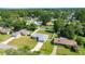 An aerial shot shows the property nestled among trees and surrounding neighborhood at 4325 Se 60Th St, Ocala, FL 34480