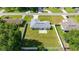 An aerial view showcases the home with a large fenced yard, modern roof, and surrounding neighborhood at 4325 Se 60Th St, Ocala, FL 34480