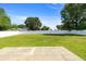 Expansive backyard with lush lawn, patio, and white privacy fence at 4325 Se 60Th St, Ocala, FL 34480