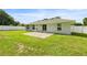 Backyard features a well-maintained lawn, privacy fence, and cozy patio space at 4325 Se 60Th St, Ocala, FL 34480