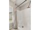 Bright bathroom boasting a shower with white surround and window at 4325 Se 60Th St, Ocala, FL 34480