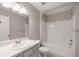 Bright bathroom features a tub/shower combo and a vanity with modern fixtures at 4325 Se 60Th St, Ocala, FL 34480