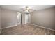 Spacious bedroom featuring wood-look flooring, ceiling fan, and neutral paint at 4325 Se 60Th St, Ocala, FL 34480