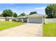 Single-story home with lush front lawn and a spacious two-car garage at 4325 Se 60Th St, Ocala, FL 34480
