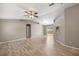 Spacious living room with light wood flooring and arched doorways at 4325 Se 60Th St, Ocala, FL 34480