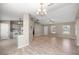 Open-concept living area with a view into the kitchen and lots of natural light at 4325 Se 60Th St, Ocala, FL 34480