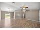 Bright living room featuring wood floors and sliding glass doors to the backyard at 4325 Se 60Th St, Ocala, FL 34480