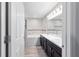 Main bathroom featuring a soaking tub, double sink vanity and decorative mosaic tile at 4955 Se 89Th Place Rd, Ocala, FL 34480