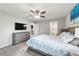 Bright main bedroom boasts neutral walls, plush carpeting and an ensuite bathroom entrance at 4955 Se 89Th Place Rd, Ocala, FL 34480